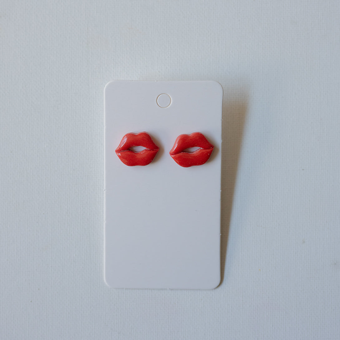 Kiss + Tell